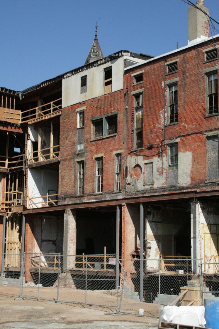 An overall view of the rear of the Carlisle and Howson buildings show many details, including the turret peeking above.  
