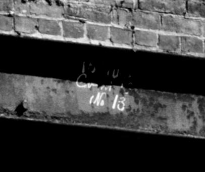 There may be construction marks on the left end of this beam; in the center may be "15' 10" / C----- / (No 13" painted on it.  
