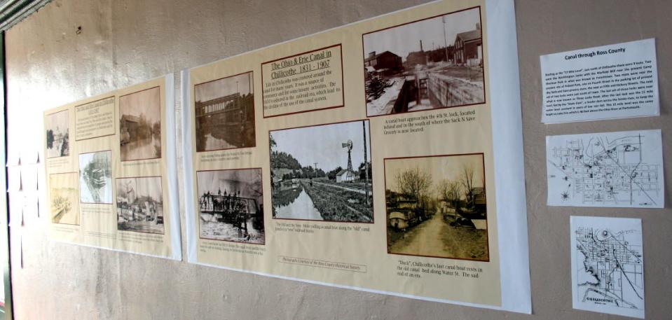 The banners on display in Emmitt's warehouse, with the photo in question in the lower right.